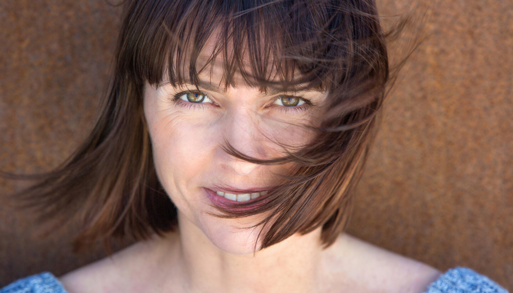brunette woman with bangs close up