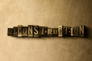Close-up of vintage typeset words reading "Reconstruction"