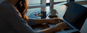 Woman typing on laptop