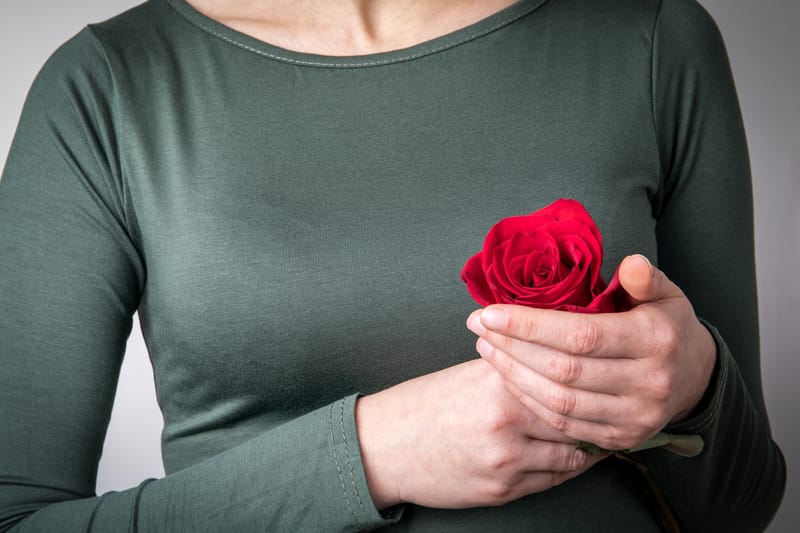 Woman holding rose