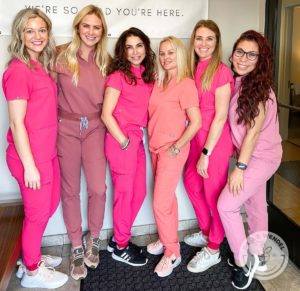 dr j j wendel team wearing pink scrubs for breast cancer awareness