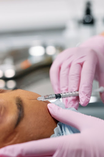 woman of color receiving botox