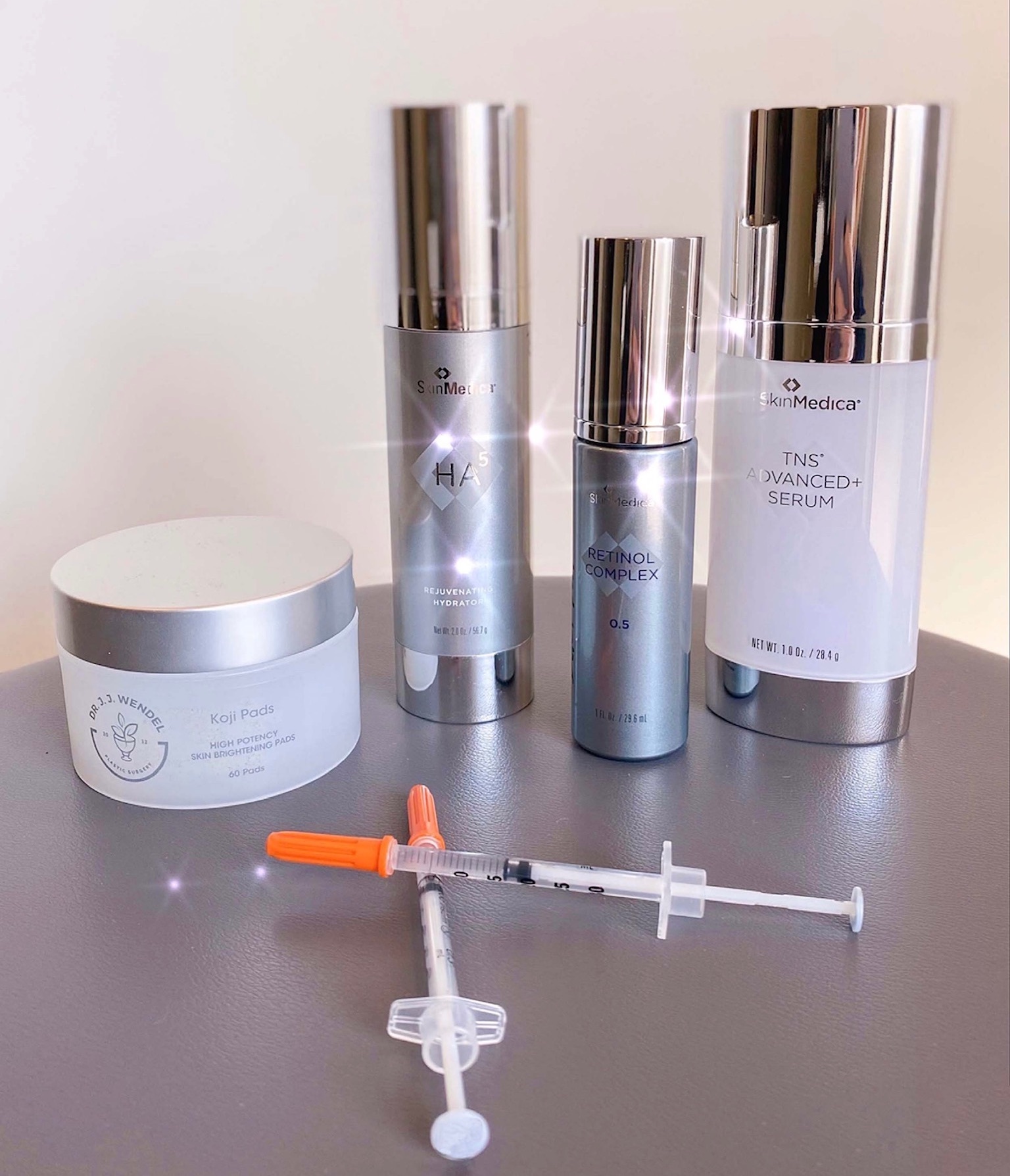 skinmedica and wendel skin care products on table