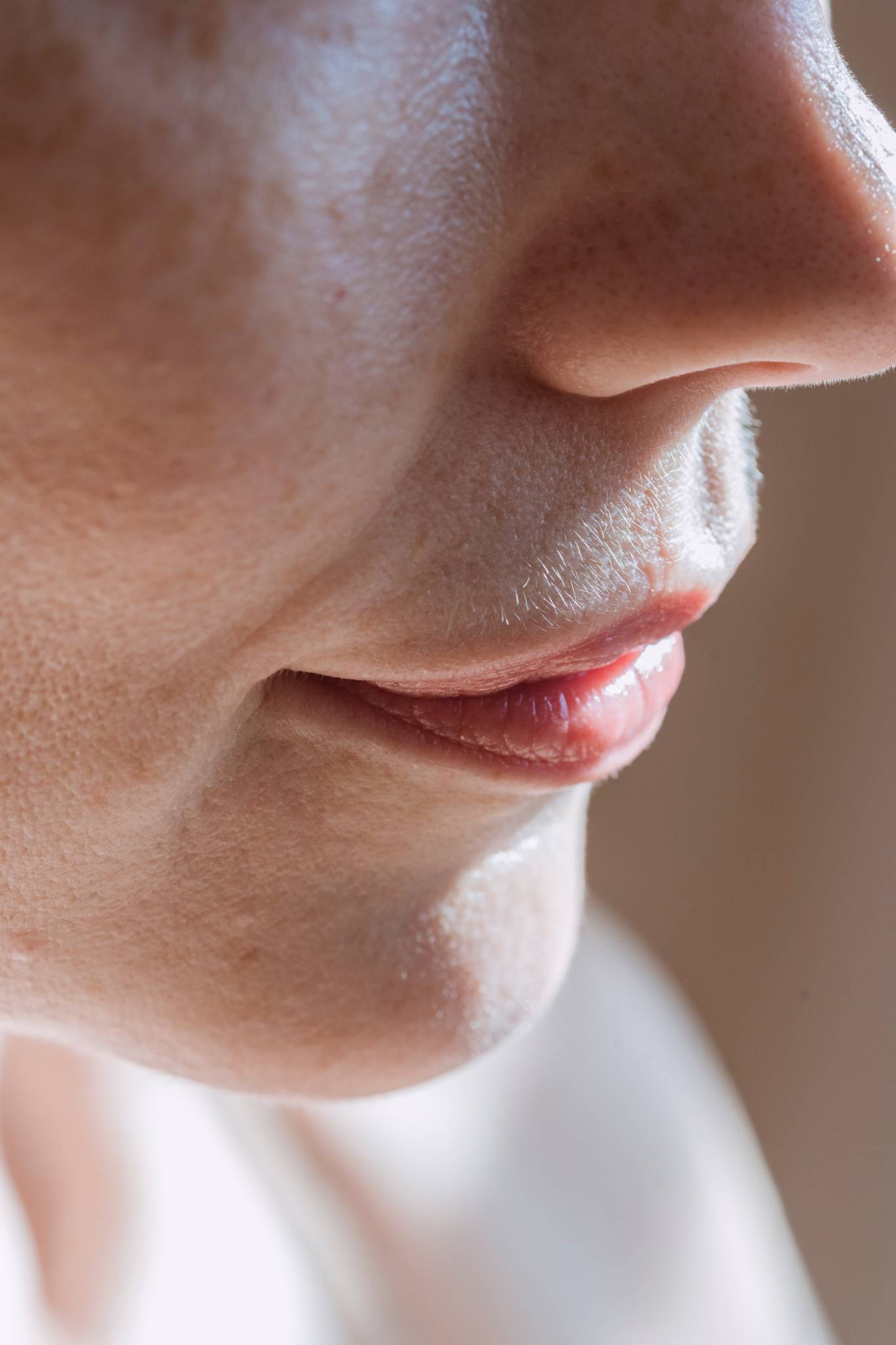 woman's chin, lips and nose in frame
