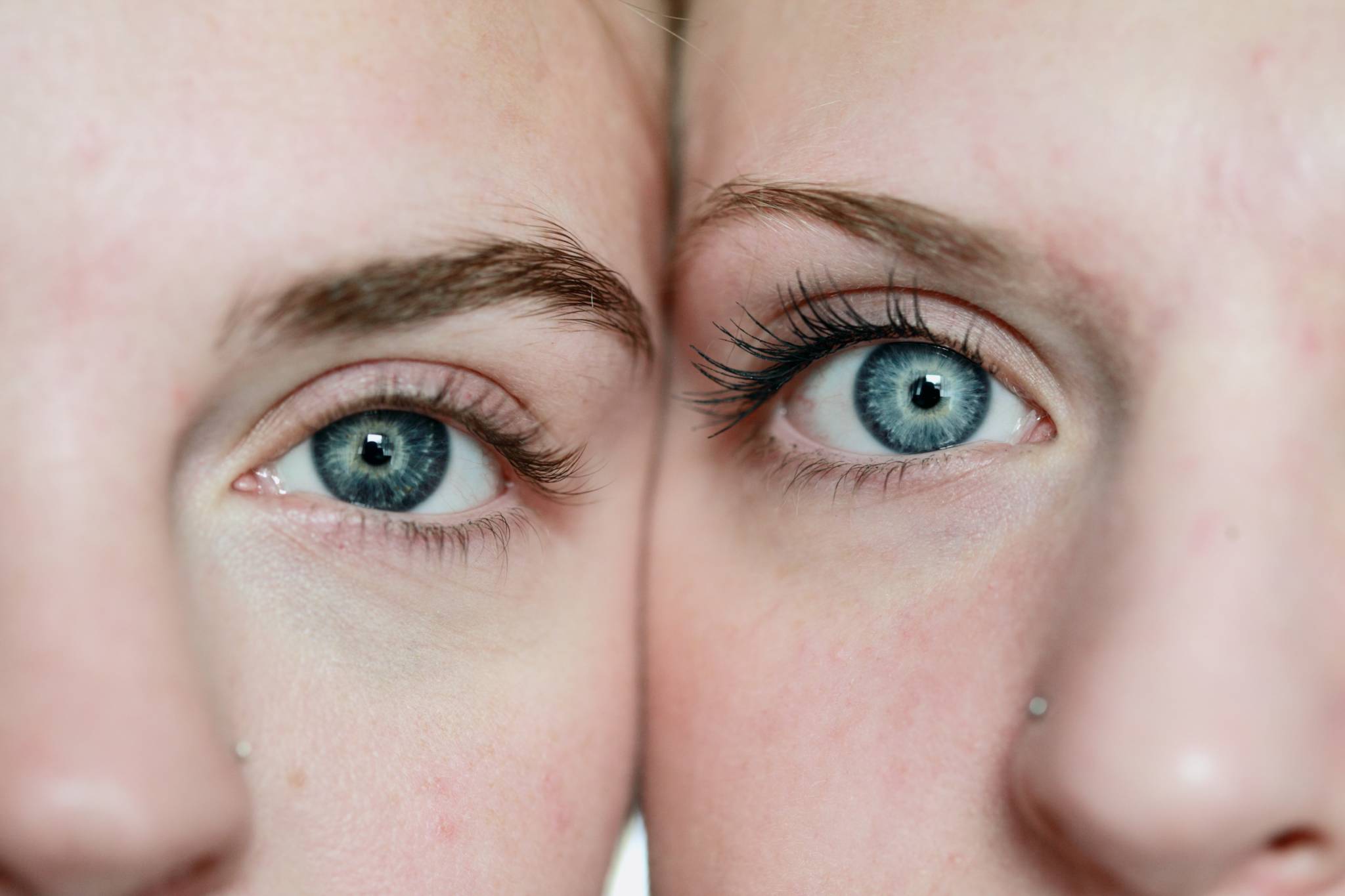 close up on eyes, eyebrows, and nose of two caucasian women with blue eyes