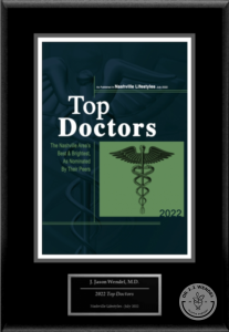 Top Doctors graphic from Nashville Lifestyles July 2022 with caduceus on green square on black background