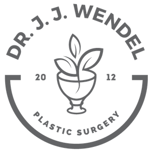 gray logo of Dr. J. J. Wendel Plastic Surgery on a white background