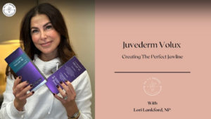 Lori Lankford smiling holding two purple boxes of Juvéderm Volux