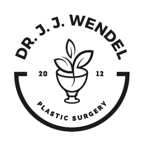 large circular white logo with black letters that read Dr. J. J. Wendel Plastic Surgery