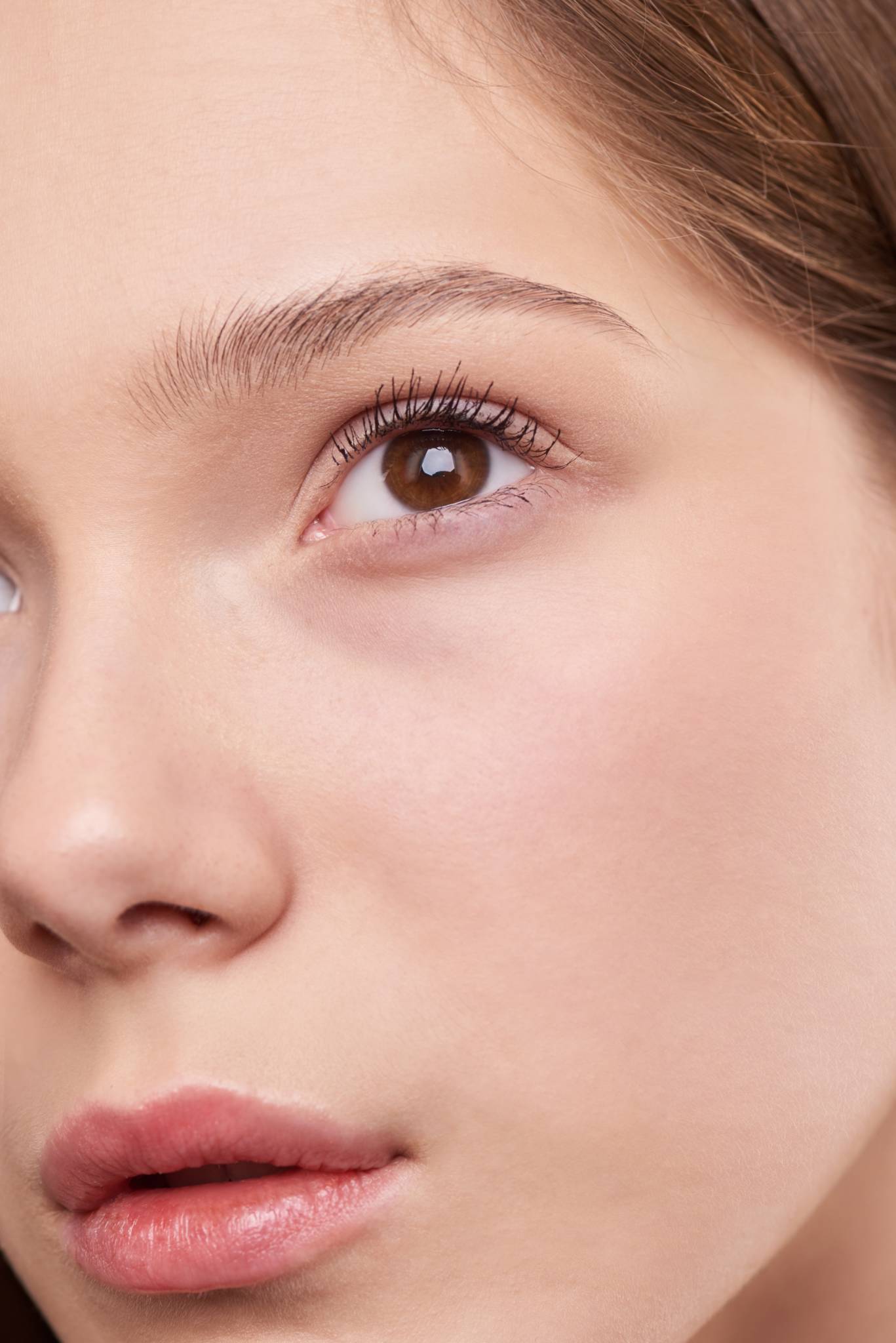 Close up of a brown eyed woman wearing no make-up