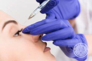 right profile view of woman getting Botox to bridge of nose