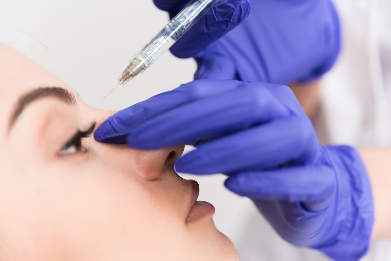 right profile view of woman getting Botox to bridge of nose