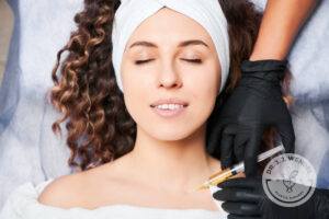 Woman getting minimally invasive injections in neck to prevent wrinkles.