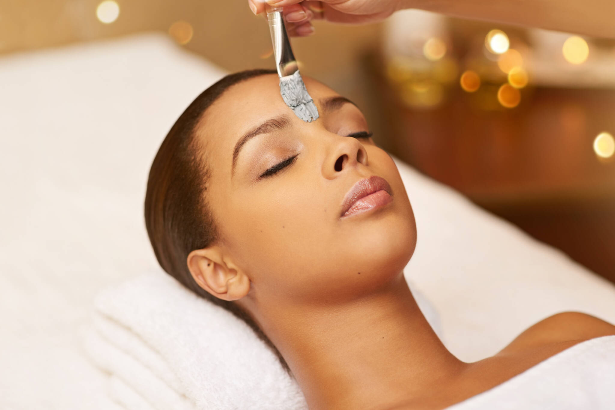 Cropped shot of a young woman enjoying a skincare treatment at the spa.