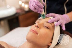 woman having microdermabrasion facial treatment