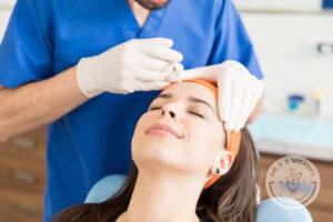 Woman receives a Baby Botox injection in her forehead to treat wrinkles.