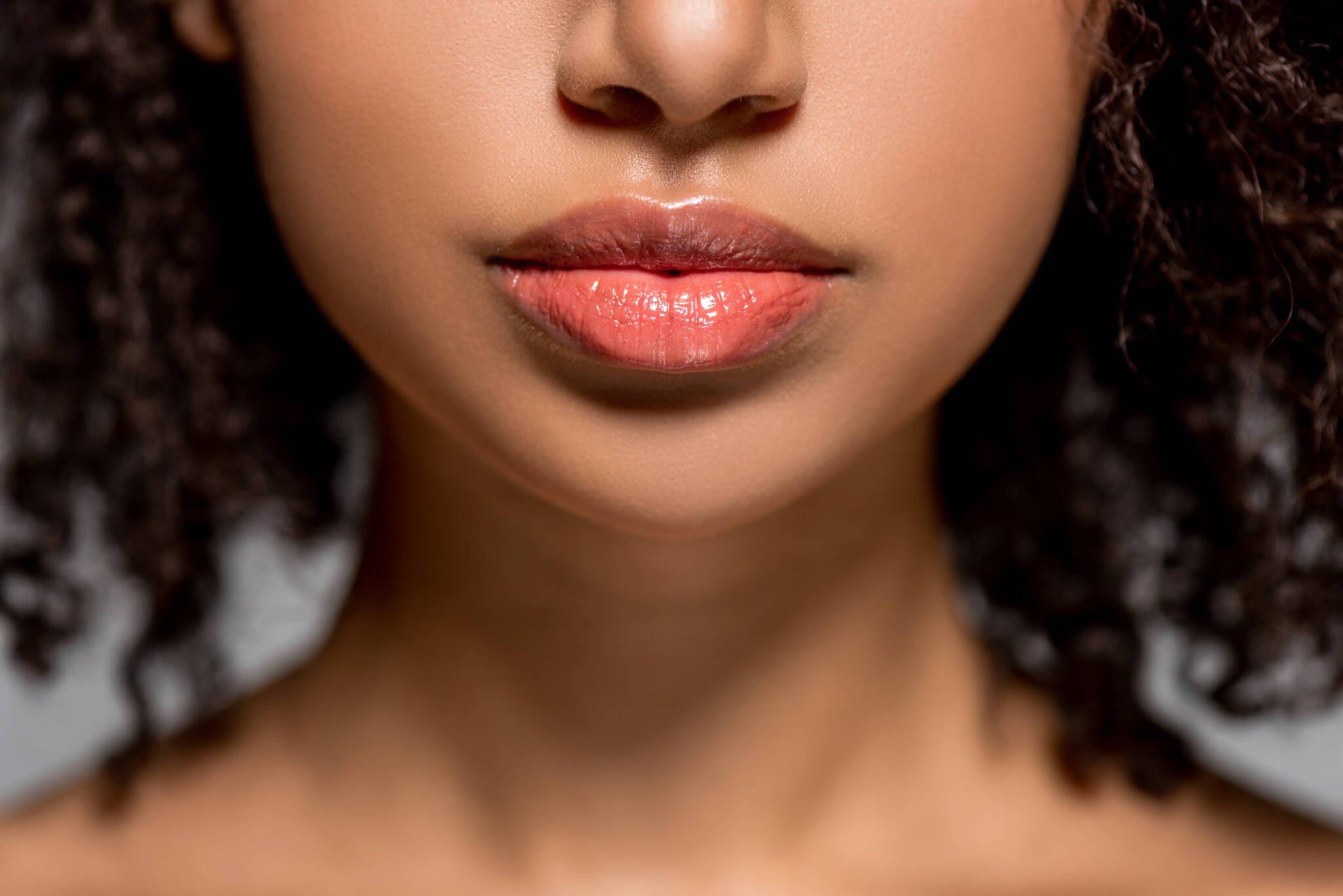 Close cropped photo of a woman's full lips