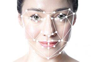 Woman has her face analyzed for facial balancing.