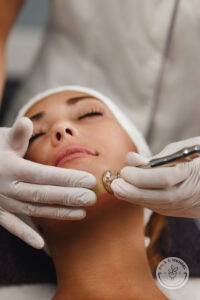 Woman receives a sculpting facial