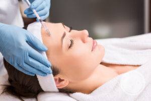 Woman receiving cosmetic injections
