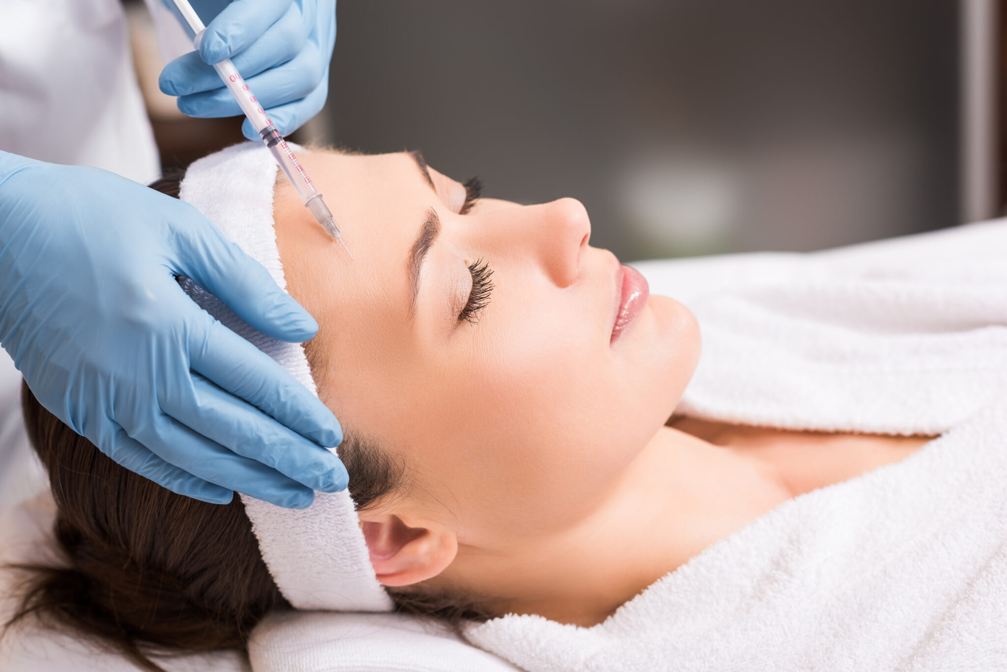 Woman receiving cosmetic injections