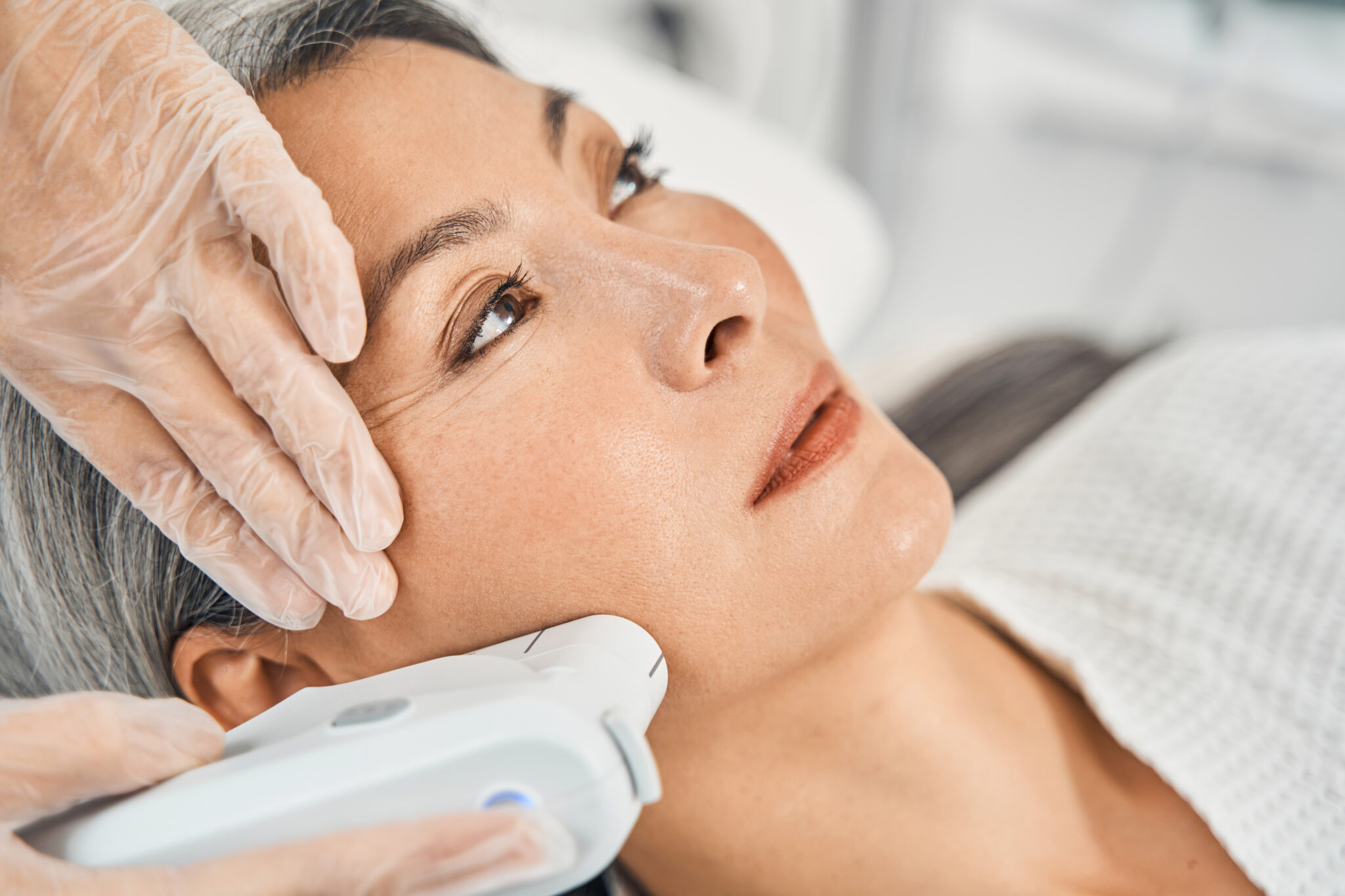 Woman has wrinkle reducing cosmetic treatment