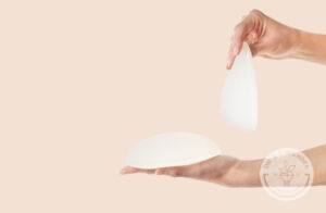 Breast implants being held up and laying flat