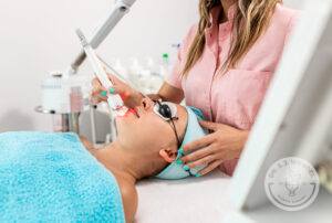 female patient undergoing laser treatment