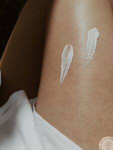 spots of moisturizer on a leg