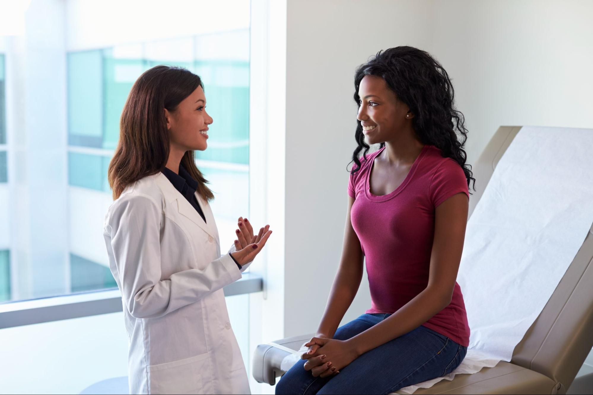 Plastic surgeon consulting with a patient to discuss thigh lift surgery and personalized body contouring options.