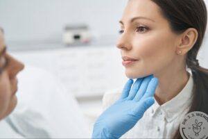 Woman receiving Volux jawline filler treatment from a plastic surgeon
